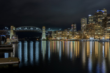 Night view of Burrard Street Bridge and downtown Vancouver, British Columbia.