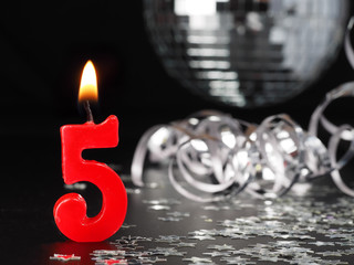 Red candles showing Nr. 5  Abstract Background for birthday or anniversary party.