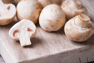 Fresh champignons on a cutting board