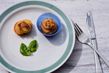 Freshly baked potatoes muffin whit basil and bacon