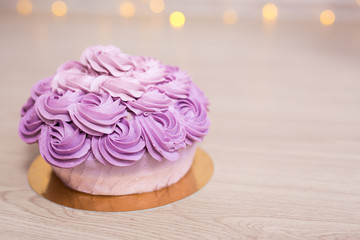 purple cupcake on wooden table background