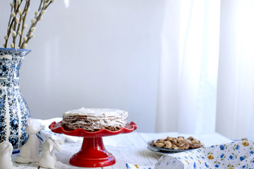 cake on a red stocking and on a white background. Bouquet of flowers. Free space for text