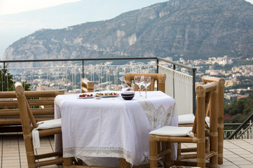 Prepared for supper table on the terrace overlooking the Bay of Naples and  Vesuvius. Sorrento. Italy