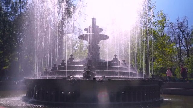 Beautiful fountain in city park, Baroque architecture.