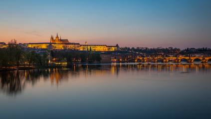 Illuminated Prague Castle and Charles bridge after the sunset, Czech Republic
