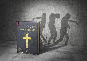 Enslavement concept. Zombies religion. Bible cast shadow in form of group of zombie. 3d illustration