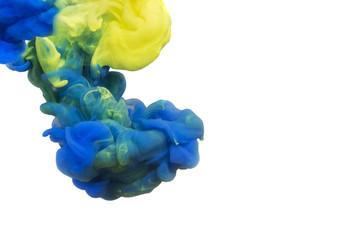 Obraz premium Colors dropped into liquid and photographed while in motion. Cloud of silky ink in water on white isolated background, an abstract banner.