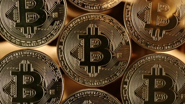 TOP VIEW: Many bitcoins are grilled in a flame
