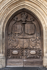 Fototapeta na wymiar Old wooden door with carving, Bath, UK