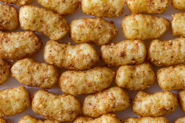 Background of extruded peanut flips from above.