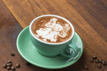 angel coffee art with dark background