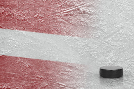 Image of the Latvian flag with a hockey puck
