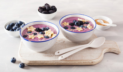 healthy berry smoothie bowl with banana and sesame seed