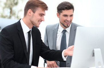 Fototapeta premium employees are talking sitting behind a Desk