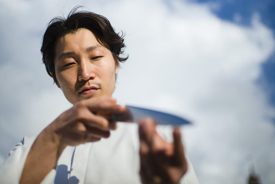 Japanese chef with knives in Paris