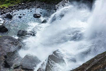 waterfall in the mountains of Norway in summer