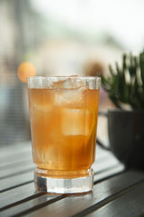Refreshing orange cocktail, outdoors
