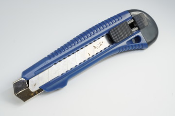 Cutter knife on a white background