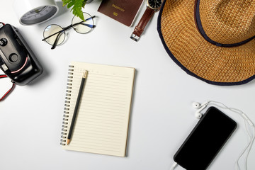 Travel Blogger accessories on white wood copy space