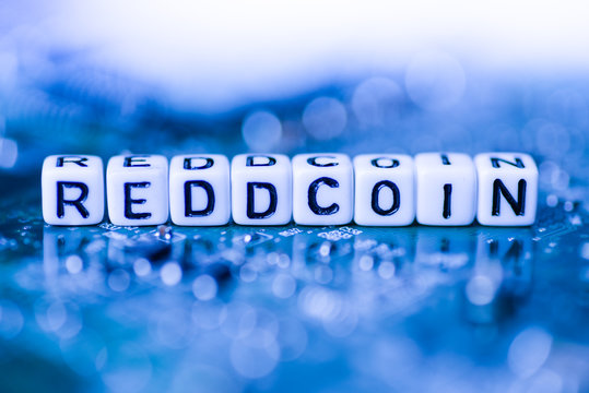 Word REDDCOIN formed by alphabet blocks on mother cryptocurrency