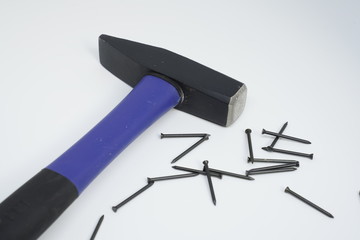 Hammer with pins on white background
