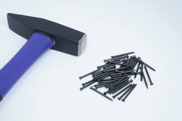 Hammer with pins on white background