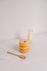 Bottle of milk and donuts, selective focus
