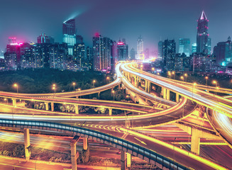 Fototapeta na wymiar View over the famous highway intersection in Shanghai, China. Modern architecture of a big city. Scenic nighttime skyline.