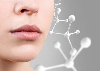 Perfect female lips near white molecule chain.