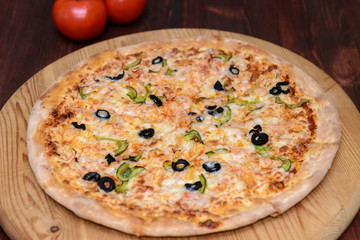 Pizza on wooden board