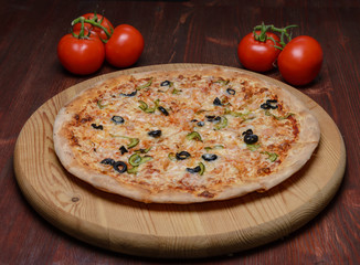 Pizza on wooden board