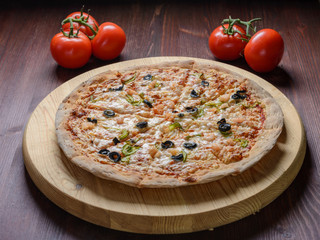 Pizza on wooden board