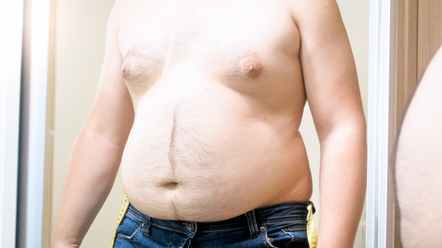 Closeup photo of fat man with big belly and breast