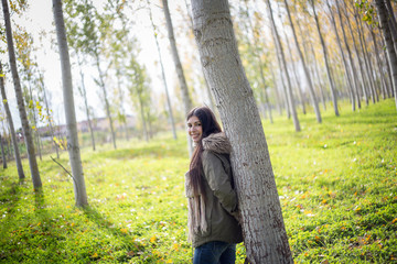 Beautiful young woman posing in the park