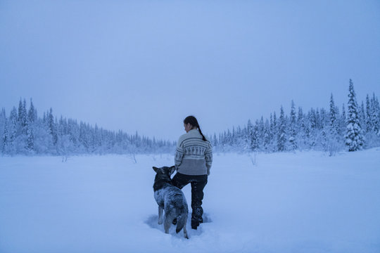 Woman with dog at winter