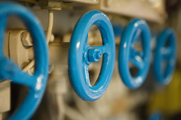 blue metal valves on engineering construction