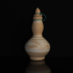 the earthenware on the black background