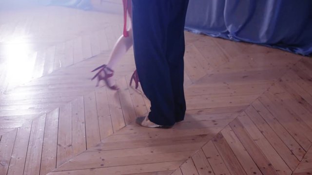 Legs stepping into tango dance
