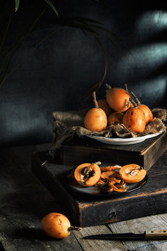Eating fresh loquat fruit
