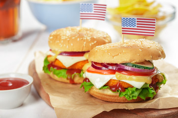 Fast food, homemade burger on a wooden background