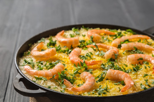 Paella with chicken, shrimp and squid rings. Copy-space