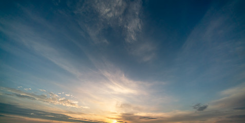 Naklejka na ściany i meble Sunset / sunrise with clouds, light rays