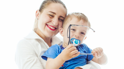 Closeup portrait of smiling young businesswoman embracing her adorable toddler boy