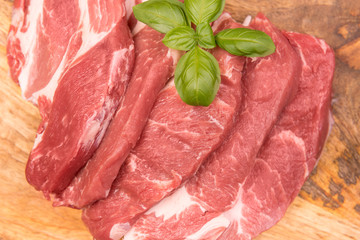  raw pork on a background of mango boards