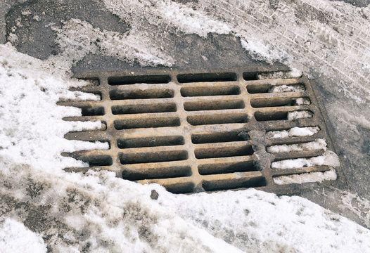 A road grating in the winter.