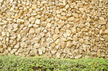 A Close-up of a brick color of stone wall for background texture.