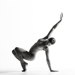 Young beautiful athlete is posing in studio