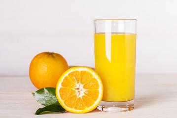 glass of orange juice on a table