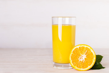 glass of orange juice on a table