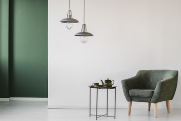 Upholstered armchair in minimalist interior